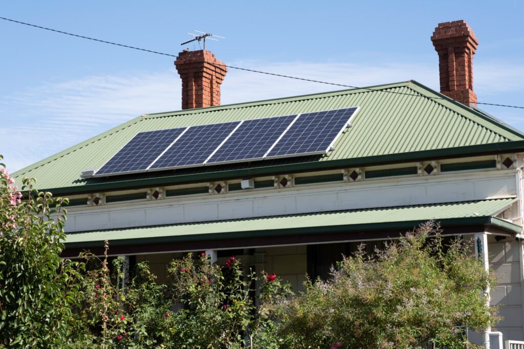 Green roofed home with solar panels.