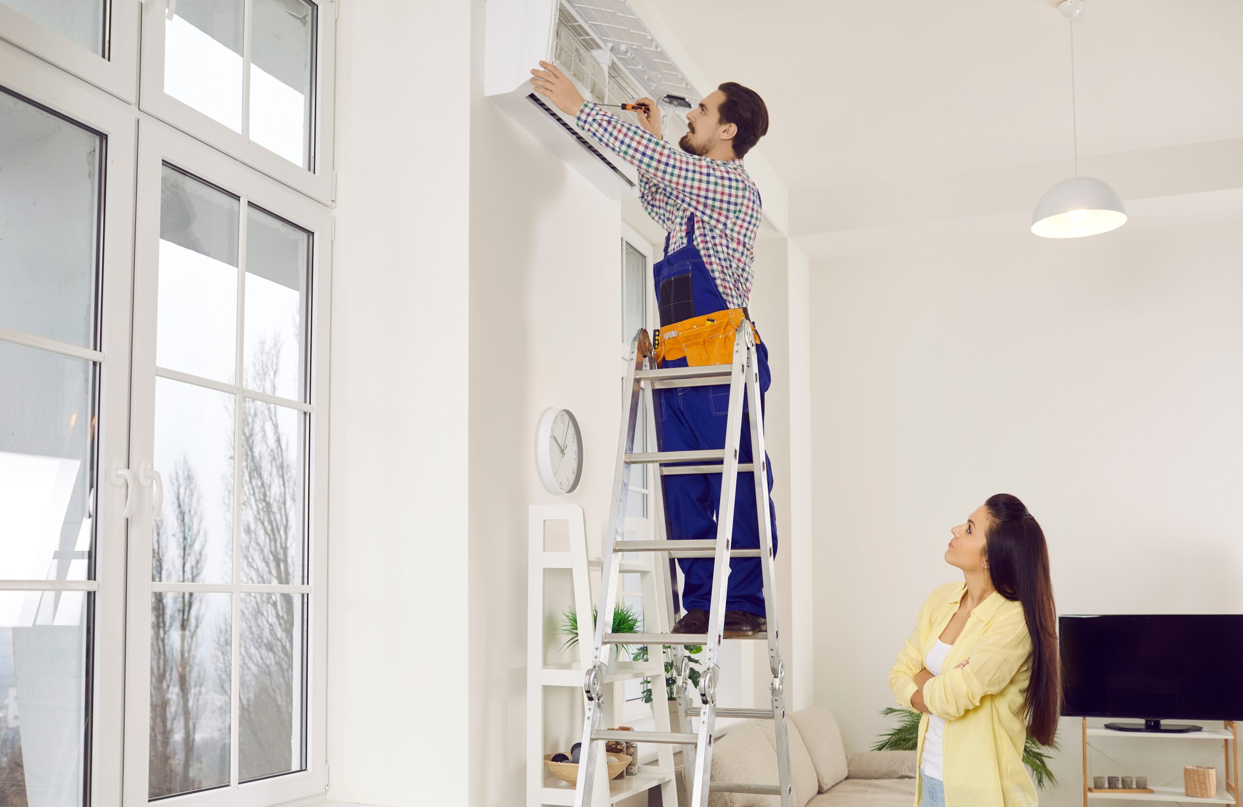 Technician Repairing Air Conditioner